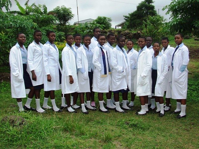 PGSS Limbe students in navy and white uniform with laboratory coats on the Mile 3 campus